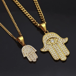 Hamsa hand pendant necklace set with sparkling stones on elegant gold Cuban chain link