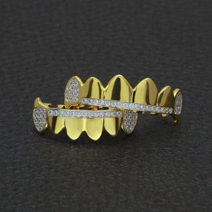 Detailed macro view of gold plated hip hop grillz set with micro paved AAA cubic zirconia