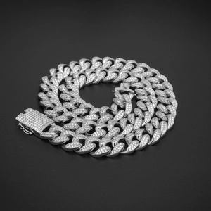 Close-up of 20mm silver Cuban link chain with paved zircons and heavy duty square clasp