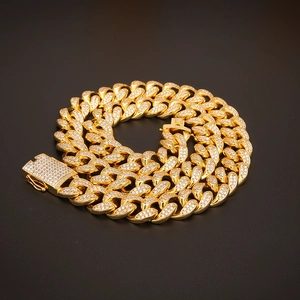 Detailed macro view of 20mm gold-plated hip hop Cuban link chain with micro-pave zircons