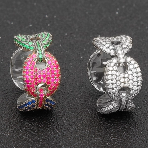 Close-up of hip hop pig nose rings with colorful cubic zirconia in silver plating