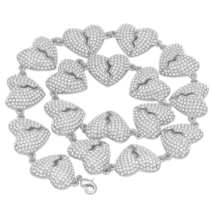Detailed macro view of iced out silver broken heart link necklace with pave set crystals