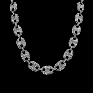 Detailed close-up of iced out coffee bean link chain with sparkling silver rhinestones
