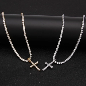 Close-up of gold and silver hip hop tennis chains with sparkling zircon cross pendants