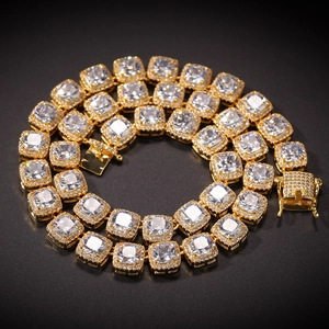 Detailed macro view of hip hop gold tennis chain with square zircons and box clasp