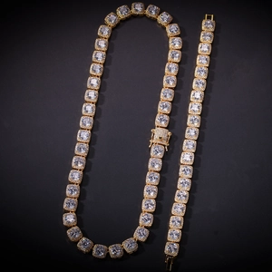 Macro detail of gold plated square zircon tennis necklace and bracelet set