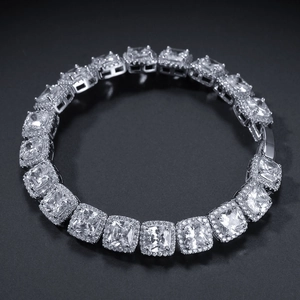 Macro view of silver tone square cubic zirconia stones and pave setting on hip hop chain