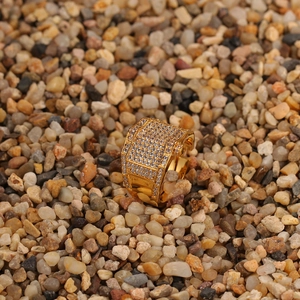 Macro shot of hip-hop men's gold ring with dense cubic zirconia pavé setting detail