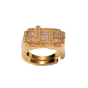 Macro detail of gold geometric interlaced ring with micro-pave zircons and open band
