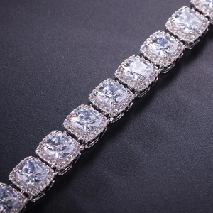 Detailed macro view of square halo tennis bracelet with silver-tone zircon settings