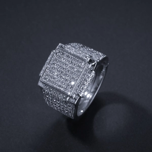 Macro shot of square hip-hop ring with dense pave setting white stones and silver finish