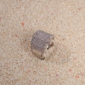 Macro shot of silver square hip-hop ring with pavé-set white cubic zirconia stones