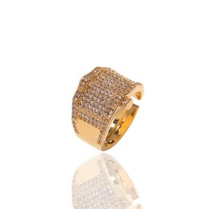 Detailed macro view of the gold adjustable hip hop ring with sparkling white zircons