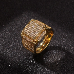 Detail view of hip hop gold square ring with micro-paved zircons and sparkling stones