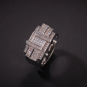 Macro detail of men's hip hop ring showing square zircon paving and silver metal finish