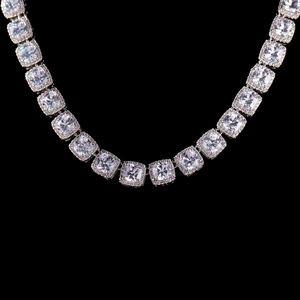 Macro shot of silver hip hop chain featuring cushion cut zircon halo square links