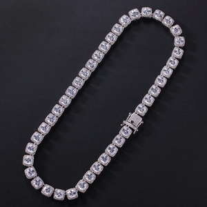Detailed macro view of square cut zircon tennis chain with micro paved stones and box clasp