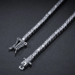 Elegant silver 2mm zircon tennis bracelet with secure clasp over black background