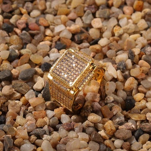 Macro shot of hip hop square gold ring with pave setting cubic zirconia on stones