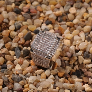 Detail of hip hop men's square ring with iced out micro pave zircons on silver base
