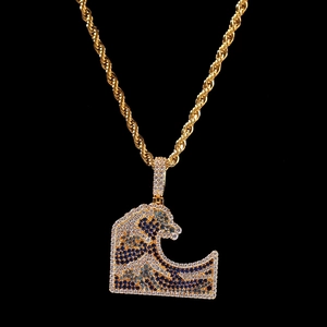 Macro shot of hip-hop wave pendant with blue and white pave-set cubic zirconia