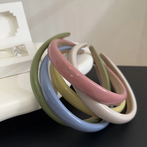 Glossy colorful leather-style padded headbands in green pink and blue colors