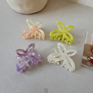 Elegant hollow acetate butterfly hair claws in pastel peach, lime, purple and white