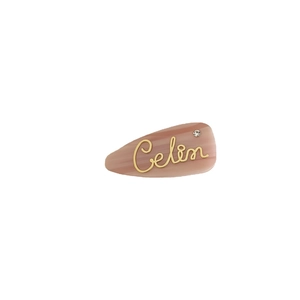French chic acetate hair clip in marble pink with golden cursive letter and rhinestone