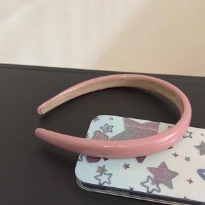 Glossy pink padded leather headband with chic three-dimensional shape for women