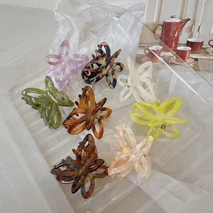 Romantic acetate butterfly hair claws in 7 soft spring colors with cutout design
