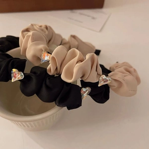 Elegant rhinestone heart satin headbands in black and beige for a high-volume look