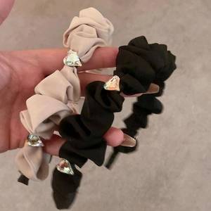 Chic ruched fabric headbands set in black and white with rhinestone heart accents