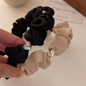 Elegant set of two silk scrunchie headbands in black and beige with heart rhinestones