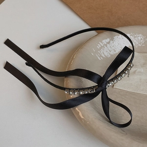 Elegant black satin headband with sparkling rhinestones and long flowing bow ribbons