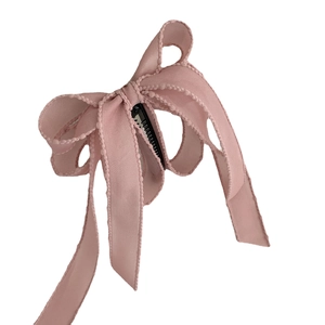 Pink ribbon bow banana clip with wavy texture and secure metal grip for high ponytail