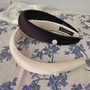Padded velvet headband with pearl accent in chocolate brown and beige silk finish