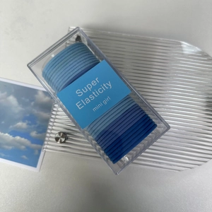 Blue elastic hair ties set in a clear box with high stretch and minimalist design