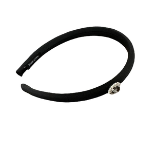 Handmade black fabric headband with a rhinestone-trimmed heart jewel accessory