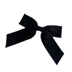 Oversized black satin bow hair clip with long ribbons for elegant women's hairstyles