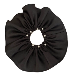 Elegant black satin scrunchie featuring high-elastic fabric and polished white pearls