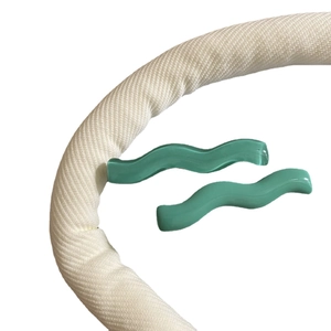 Set of two wavy mint green acrylic hair clips in translucent and solid candy colors