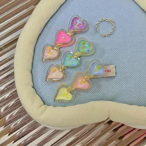 Vibrant candy color heart-shaped acrylic duckbill hair clips for women in various shades