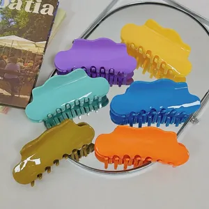 Set of six colorful large cloud-shaped hair claws in vibrant glossy acetate finish