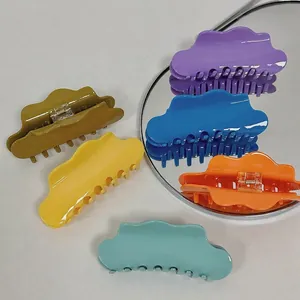 Colorful cloud-shaped acetic acid hair claws in vibrant purple, blue, and orange finishes
