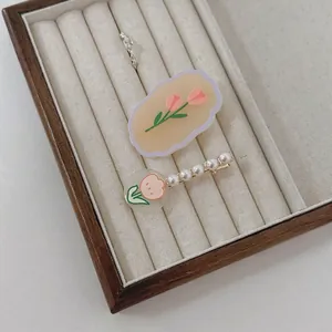 French cream tulip hair clip set with pearls and resin flower designs for women