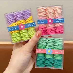 Set of colorful elastic hair bands for girls in transparent gift boxes with floral details