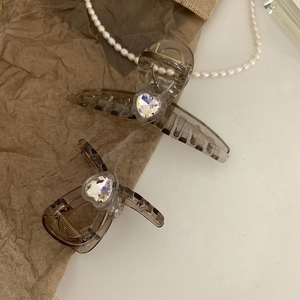 Lot de deux pinces à cheveux grises transparentes ornées de strass en forme de cœur
