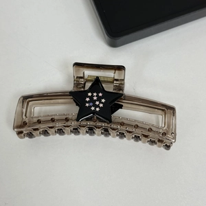 Rectangle smoky grey hair claw clip featuring a matte black star with white patterns