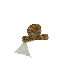 Acetate hair claw clip with brown tortoiseshell pattern and gold Barrette la France text