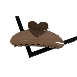 Brown heart-shaped hair claw clip with glossy finish and secure teeth for hairstyling